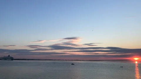 Beautiful view of the setting sun on a background of water Stock Footage 127529759