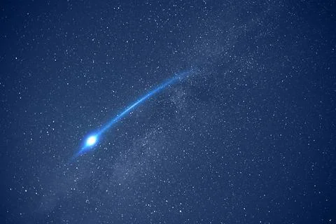 Beautiful view of shooting star in night sky Stock Photos