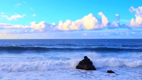 Beautiful view of slow motion waves on the coast with blue cloudy sky	 Stock Footage 149321981