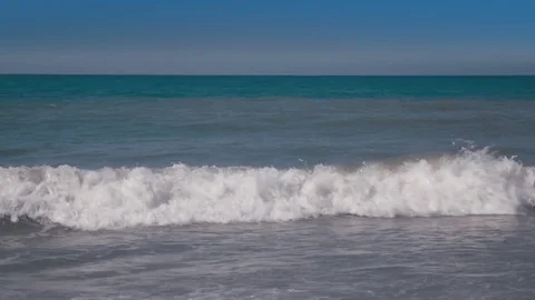 Beautiful view on small in front surf beach next to ocean with breaking Stock Footage
