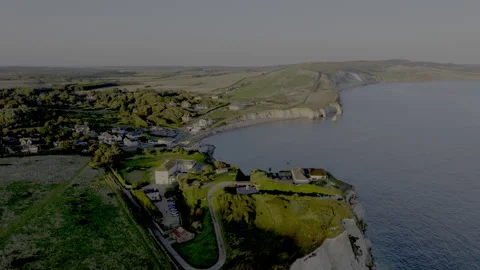 A beautiful view of a small town with a beach and a cliff Stock-Footage 298275502