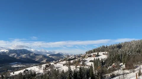 Beautiful view of snow-capped alpine mountains on a bright winter sunny day Stock Footage 255643242