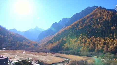 Beautiful view of snow capped Mountain and blue sky in autumn Stock Footage 137094950
