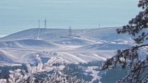 Beautiful view of the snow-capped mountains with electric supports Stock Footage 102237513