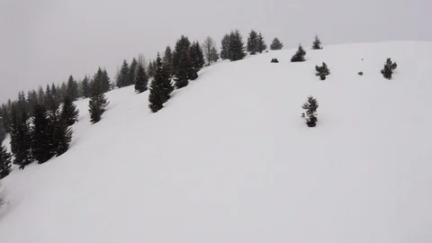 Beautiful view on snowfall over skiing tracks in mountains Stock Footage 102832471