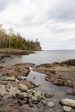 A beautiful view of Split Rock Lighthouse on the rocky coast of Lake Superior. Stock Photos