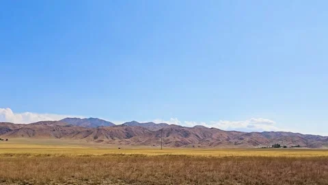 A beautiful view of the steppe, hills and sky. Stock Footage 314908928