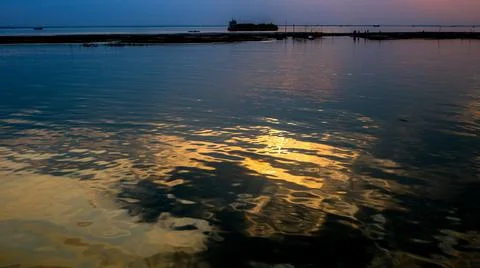 Beautiful view of the sun setting on the river bank. The sun's shadow on the Stock Photos