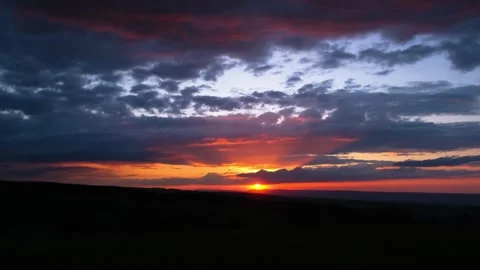 Beautiful view of sunset and clouds moving across the evening sky Stock Footage 284109432