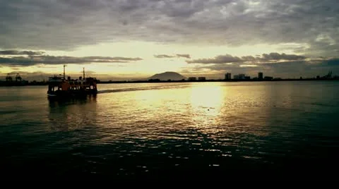 A beautiful view of sunset and a ferry passing by. Stock Footage 11011443