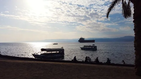 Beautiful view, sunset on the beach. On the background of clouds and ships. Stock Footage 123599615