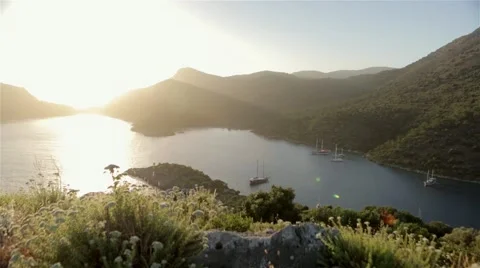 Beautiful view from sunset at a desolate bay Stock Footage 60640676