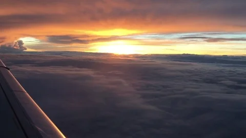 Beautiful view of sunset over clouds from airplane in the sky Stock Footage 78168795
