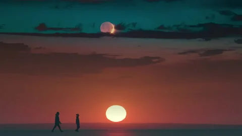The beautiful view on the sunset over snow field and walking expeditors Stock Footage 196285988