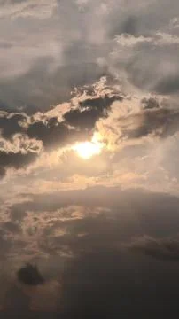 Beautiful view of sunset rays in the sky breaking through the clouds Stock Photos
