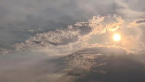 Beautiful view of sunset rays in the sky breaking through the clouds Stock Photos