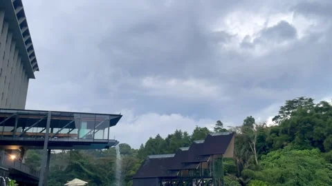 Beautiful view surrounded by lush green forest under cloudy sky. Stock Footage 320500327