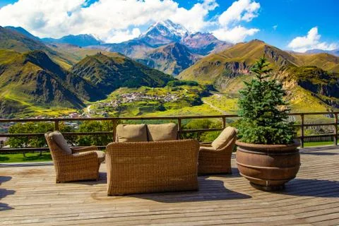 Beautiful view from terrace cafe of the overlooking the high mountain top Kazbek Stock Photos
