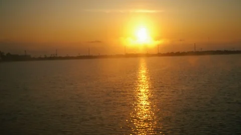 Beautiful view from train window on the surising orange sun under the trees line Video stock 109012165