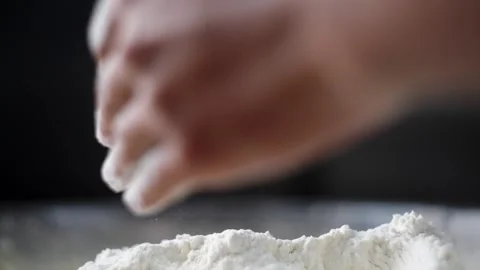 Beautiful view of two hands mixing dough and flour in a fancy kitchen Stock Footage 304682063