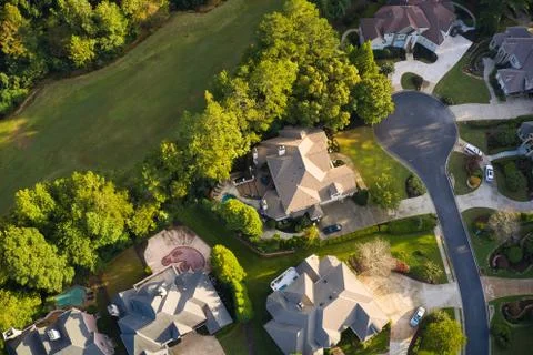 Beautiful view of an upscale sub division with golf course and a pond in suburbs Fotos Stock
