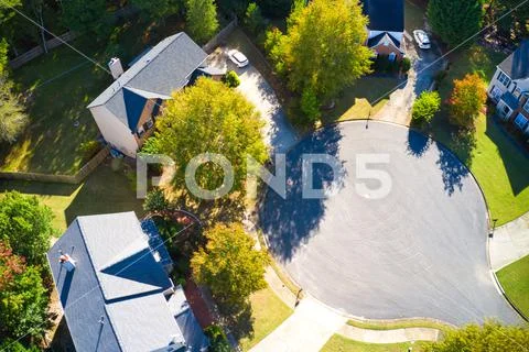 Beautiful view of an upscale sub division with golf course and a pond in suburbs