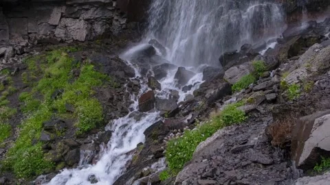 Beautiful view of a waterfall in a mountain gorge in the North Caucasus Stock Footage 284123731