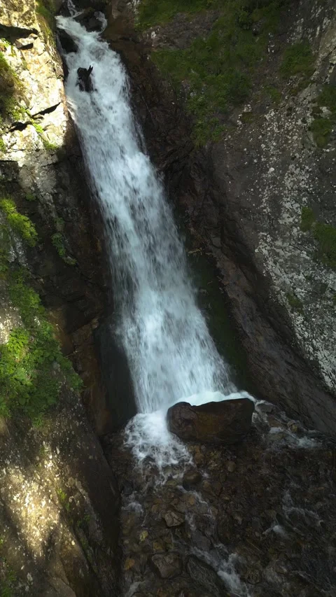 Beautiful view of a waterfall in a mountain gorge in the North Caucasus Stock Footage 284137708