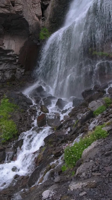 Beautiful view of a waterfall in a mountain gorge in the North Caucasus Stock Footage 284140491