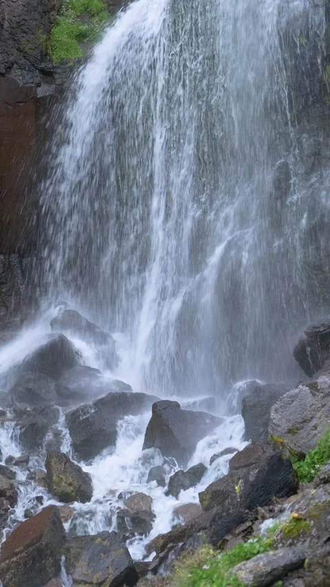 Beautiful view of a waterfall in a mountain gorge in the North Caucasus Stock Footage 284140882