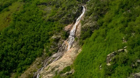 Beautiful view of a waterfall in a mountain gorge in the North Caucasus Stock Footage 285269537
