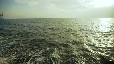 Beautiful view of the waves and two young people staying together and relaxing Stock Footage 68856236