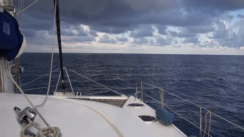 Beautiful view from white sailing catamaran boat traveling in Mediterranean sea Stock Footage 130131817