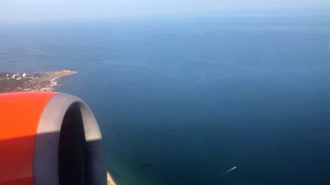 Beautiful view from the window of an airplane Stock Footage 131679195