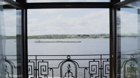 A beautiful view from the window of the river along which a cargo boat is Stock Footage 328299219