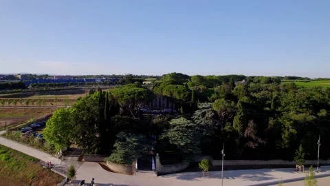 The beautiful villa being shown behind some big trees in Montpellier, Stock Footage 201247518