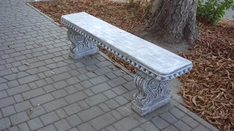 Beautiful vintage bench with patterns on the sidewalk Stock Footage 139465384