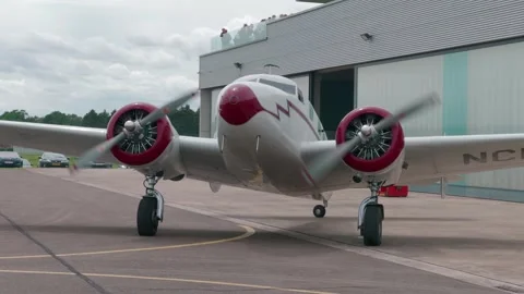 Beautiful Vintage Lockheed Electra Airplane Taxiing at the Airfield CU Stock Footage 292643256
