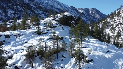 Beautiful Vistas while Flying Through Snowy Mountain Valley Stock Footage 187789912