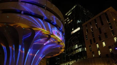 Beautiful VIVID light tracking to Sydney skyscrapers 6K Stock Footage 310977248