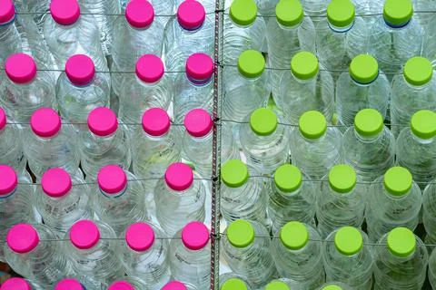 Beautiful wall made of multi colored recycled plastic bottles..Bottle recyc.. Stock Photos