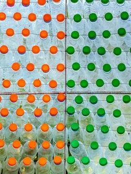 Beautiful wall made of multi colored recycled plastic bottles..Bottle recyc.. Stock Photos
