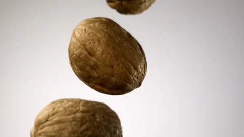 Beautiful walnuts falling in slow motion Stock Footage 151042122