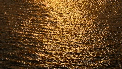 Beautiful warm sunset reflections on water surface Stock Footage 76080728