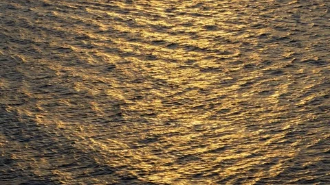 Beautiful warm sunset reflections on water surface Stock Footage 78740037