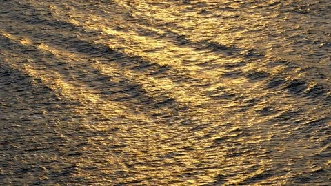 Beautiful warm sunset reflections on water surface Stock Footage 78740050