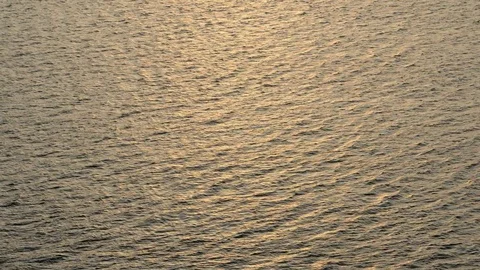 Beautiful warm sunset reflections on water surface Stock Footage 78740166