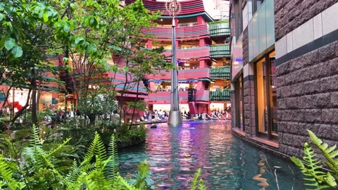 Beautiful water canal flows through the modern Canal City Hakata shopping mall. Stock Footage 334580178