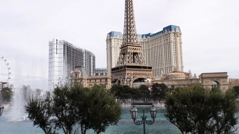 Beautiful water features facing the Eiffel Tower Restaurant in daytime Las Vegas Stock Footage 106620990