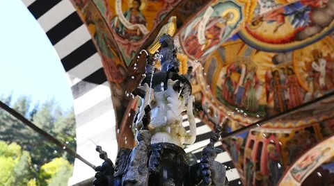 Beautiful water fountain in courtyard of male friary Rila Monastery of Bulgaria Stock Footage